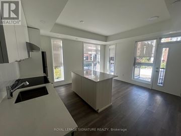 Toronto (Beechborough-Greenbrook) condo for rent - A modern kitchen with a sink and a countertop.