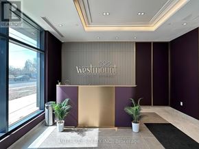 Toronto (Bathurst Manor) condo for rent - A modern lobby with a marble floor and a large chandelier.