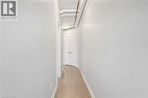 Hamilton apartment for rent - A long hallway with a door at the end.