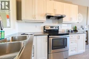 Hamilton apartment for rent - A kitchen with a stove and oven on top of a counter.