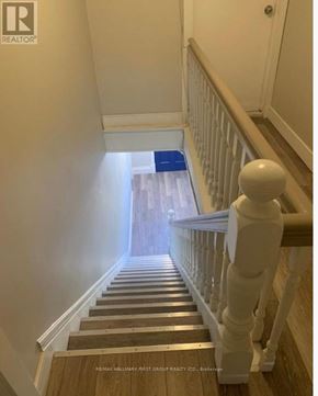 Oshawa (Lakeview) multi-family for rent - A bathroom with a toilet, sink, and bathtub.