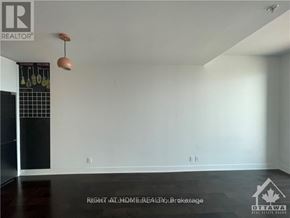 Ottawa condo for rent - A room with a light switch and a light on the wall.