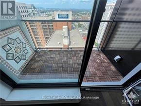 Ottawa condo for rent - A view from a window of a building with a sign that says "US Sites".