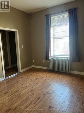 Oshawa (Lakeview) multi-family for rent - A room with a window and a radiator.