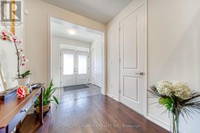 Toronto (Alderwood) apartment for rent - A hallway with a wooden floor and white walls.