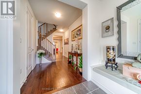 Toronto (Alderwood) apartment for rent - A hallway with a wooden floor and a staircase.