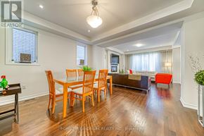 Toronto (Alderwood) apartment for rent - A dining room with a wooden table and chairs.