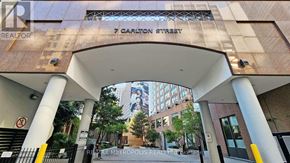 Toronto (Church-Yonge Corridor) condo for rent - A building entrance with a sign that says 7 Carlton Street.