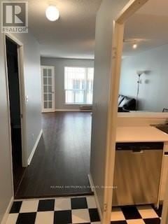 Toronto (Church-Yonge Corridor) condo for rent - A black and white checkered floor leads to a kitchen.