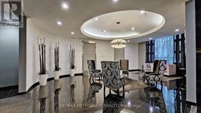Toronto (Church-Yonge Corridor) condo for rent - A modern living room with a curved ceiling and a collection of chairs.