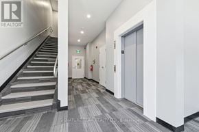 Bonnechere Valley multi-family for rent - A hallway with a staircase on the left and a door on the right.