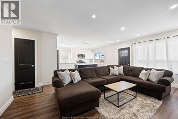 Windsor apartment for rent - A living room with a brown couch and a coffee table.