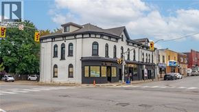 Brantford apartment for rent - A street view of a building with a traffic light on the left.