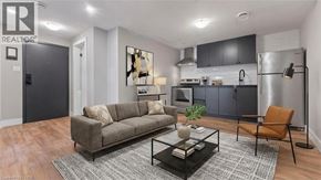 Brantford apartment for rent - A black door with the number 2 on it is in a white room.