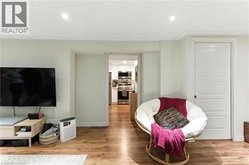 Hamilton apartment for rent - A modern living room with a white sofa and a television.