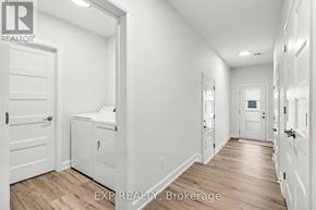 Russell apartment for rent - A white hallway with EXP Realty, Brokerage watermark.