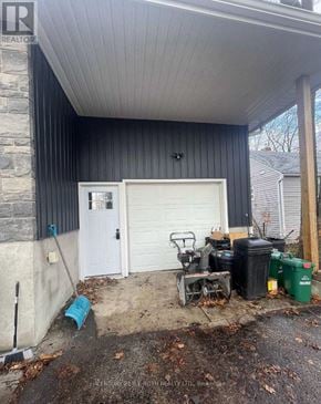 Orillia apartment for rent - A garage with a white door and a black wall.