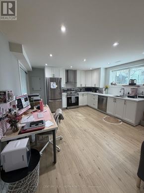 Orillia apartment for rent - A realtor's office with a desk and a cat.