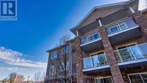 Barrie (Sunnidale) condo for rent - A building with the text BEVEL REALTY N.C. Brokerage on it.