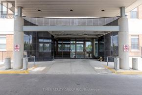 Peterborough (Ashburnham Ward 4) condo for rent - The entrance to a building with a glass door and a no parking sign.