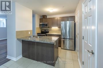 Peterborough (Ashburnham Ward 4) condo for rent - A kitchen with granite countertops and stainless steel appliances.