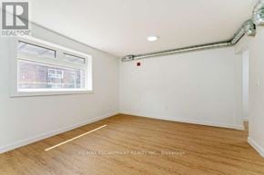 Hamilton (Stinson) multi-family for rent - A brick building with a REALTOR sign in the window.