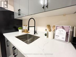 London East (East M) multi-family for rent - A modern kitchen with a white countertop and a stainless steel sink.