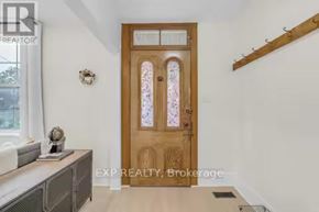 Port Hope apartment for rent - A wooden door with glass panels is the focal point of this image.