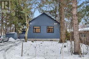 Wilmot apartment for rent - A blue house in a snowy landscape.