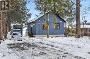 Wilmot apartment for rent - A blue house with a car parked in front of it.