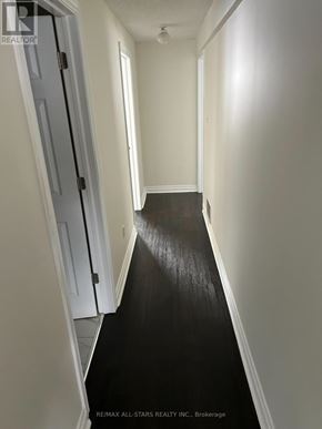 Georgina (Keswick South) apartment for rent - A hallway with a black floor and white walls.