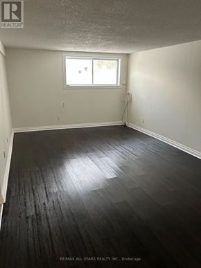 Georgina (Keswick South) apartment for rent - A room with a window and a wooden floor.