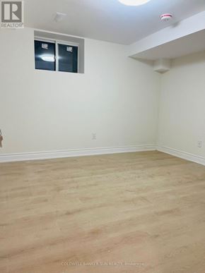 Oshawa (Lakeview) apartment for rent - A room with a window and wooden flooring.