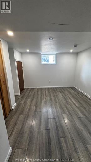 Windsor apartment for rent - A room with wooden flooring and a window.