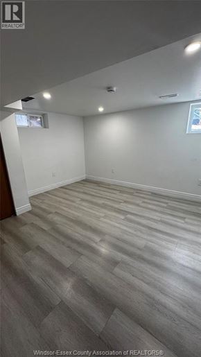 Windsor apartment for rent - A room with wooden flooring and white walls.