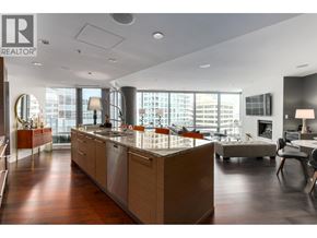 Vancouver apartment for rent - A modern kitchen with wooden floors and a large island.