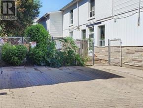 Halton Hills (Georgetown) apartment for rent - A white house with a fence and a sign that says "For Sale".