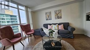Toronto (Bayview Village) condo for rent - A living room with a couch, chairs, and a coffee table.