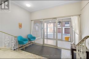 Hamilton (Stinson) multi-family for rent - A room with a white wall and a glass door leading to a balcony.