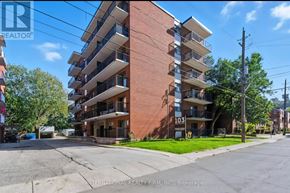 Hamilton (Stinson) multi-family for rent - A tall apartment building with the number 103 on it.