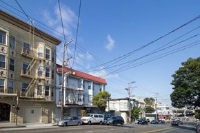 San Francisco apartment for rent - A street view with cars and buildings.