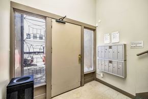 San Francisco apartment for rent - A room with a door, a wall-mounted mailbox, and a sign that says "NO SHORT-TERM PARKING".