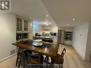 Richmond Hill (South Richvale) apartment for rent - A well-lit kitchen with a dining table set for two.