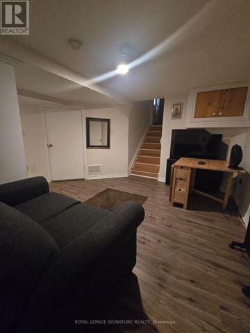 Mississauga (Mississauga Valleys) duplex for rent - A living room with a couch and a television.