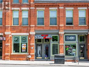 Toronto (Cabbagetown-South St. James Town) condo for rent - A red brick building with a Mobil One gas station on the ground floor.