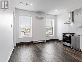 Toronto (Cabbagetown-South St. James Town) condo for rent - A well-lit kitchen with a stove top oven and a window.