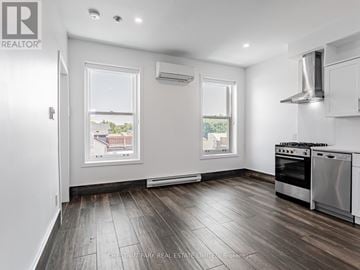 Toronto (Cabbagetown-South St. James Town) condo for rent - A well-lit kitchen with a stove top oven and a window.