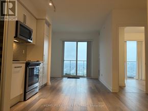 Toronto (Willowdale West) condo for rent - A kitchen with a microwave and oven above the counter.