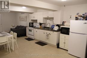 Vaughan (Maple) apartment for rent - A kitchen with white appliances and cabinets.