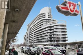 Toronto (Bayview Village) condo for rent - A large building with a red and white sign in front of it.